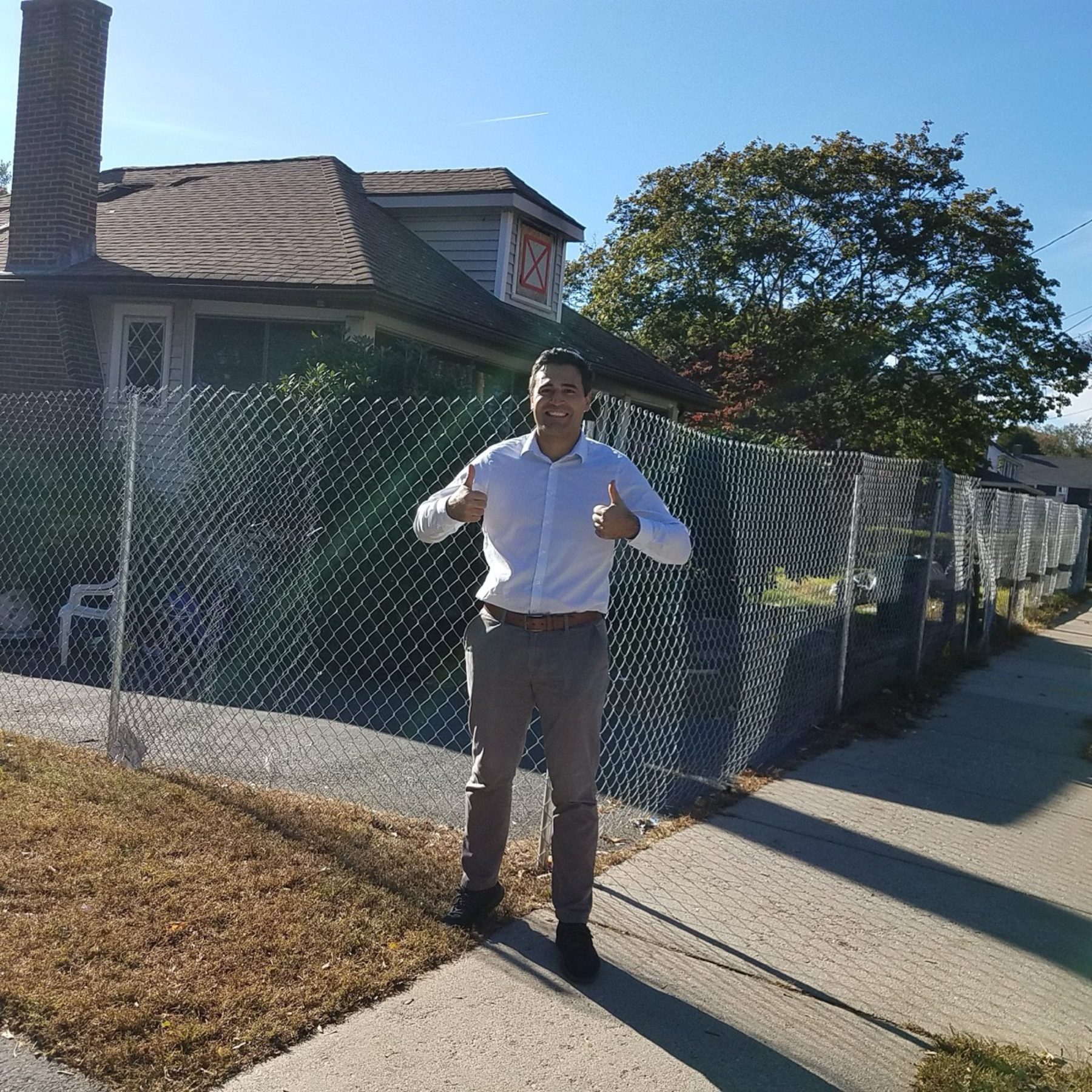 Galvanised chain link fence enclosing a residential side yard